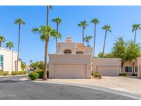 Two-story stucco home with attached garage and desert landscaping at 1301 W Coral Reef Dr, Gilbert, AZ 85233