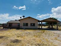 Ranch-style home with carport and large backyard at 51631 W Turney Ln, Maricopa, AZ 85139