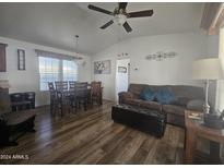 Open living room with wood floors and seating area at 8700 E University Dr # 339, Mesa, AZ 85207