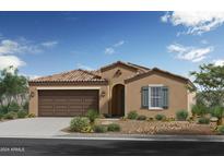 Tan single story home with brown garage door and green shutters at 5928 S 246Th Ln, Buckeye, AZ 85326