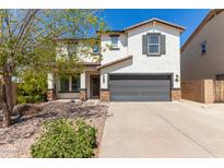 Two-story home with a welcoming front yard and attached garage at 4882 E Amarillo Dr, San Tan Valley, AZ 85140