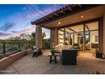 Spacious patio with outdoor furniture and sunset views at 39115 N 99Th Pl, Scottsdale, AZ 85262