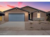 New construction home with gray garage door and stone accents at 3530 E Alexander Dr, San Tan Valley, AZ 85143