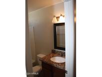 Clean bathroom with granite countertop and updated vanity at 6604 W Vogel Ave, Glendale, AZ 85302