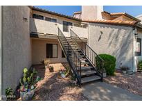 Exterior view of building with stairs and landscaping at 19820 N 13Th Ave # 226, Phoenix, AZ 85027