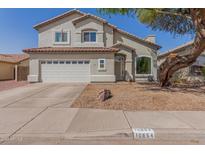 Two-story home with attached garage and landscaping at 10654 E Forge Ave, Mesa, AZ 85208