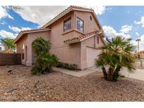 Two-story home with a two-car garage and desert landscaping at 2737 S 156Th Ave, Goodyear, AZ 85338