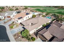 Aerial view of house, pool, and backyard; close to golf course at 18211 W Sequoia Dr, Goodyear, AZ 85338