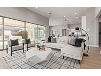 Open living room with modern furniture and access to backyard at 17871 E Paria Canyon Dr, Rio Verde, AZ 85263