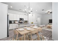 Open concept kitchen and dining area with modern cabinetry and island at 901 S Smith Rd # 1012, Tempe, AZ 85281