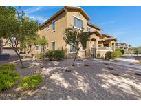 Front view of house with landscaping and walkway at 15240 N 142Nd Ave # 2111, Surprise, AZ 85379