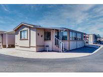 Mobile home exterior with sunroom and stairs at 17200 W Bell Rd # 1743, Surprise, AZ 85374