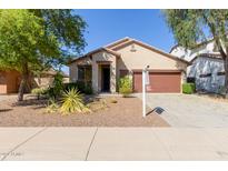 One-story home with a brown garage door at 696 E Trellis Rd, San Tan Valley, AZ 85140