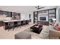 Open concept kitchen and living area with island seating and modern decor at 11673 N 136Th St # 1022, Scottsdale, AZ 85259