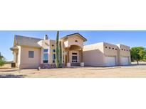 Two-story house with stucco exterior and a three-car garage at 19999 W Fawny Ln, Casa Grande, AZ 85122