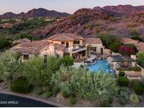 Luxury estate home nestled in the mountains with a resort-style backyard at 18651 N 101St Pl, Scottsdale, AZ 85255