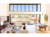 Game room with pool table and access to backyard at 10648 E Greythorn Dr, Scottsdale, AZ 85262