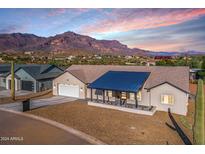 Stunning aerial view of a single-story home with mountain views at 3939 S Veronica Ln, Gold Canyon, AZ 85118