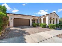 Beautiful home exterior with a large garage and manicured landscaping at 10737 E Simone Ave, Mesa, AZ 85212