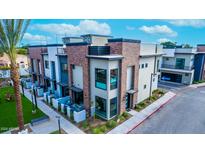 Modern townhome with private patio and walkway at 142 E Hearne Way, Gilbert, AZ 85234