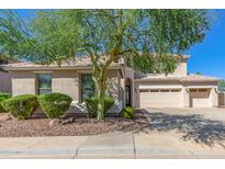 Lovely two-story home with mature landscaping and a three-car garage at 2614 W Estes Way, Phoenix, AZ 85041