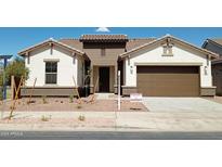 Two-story home with a two-car garage and desert landscaping at 21042 E Camina Buena Vis, Queen Creek, AZ 85142