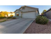 House exterior featuring a garage and well-maintained landscaping at 1425 E Leslie Ave, San Tan Valley, AZ 85140