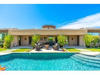 Luxury home with inviting pool, patio, and seating area at 8563 E Tumbleweed Dr, Scottsdale, AZ 85266