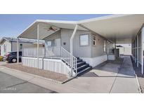 Mobile home exterior with covered carport and stairs at 535 S Alma School Rd # 45, Mesa, AZ 85210