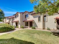 Two-story building with Spanish-style architecture and grassy area at 2970 N Oregon St # 10, Chandler, AZ 85225