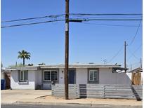 Charming single story home with modern gray fence at 206 N 5Th St, Avondale, AZ 85323