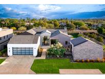 Luxury home with modern architecture and a large yard at 6850 E Joshua Tree Ln, Paradise Valley, AZ 85253