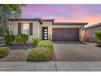 Single story home with a two car garage and landscaped yard at 4707 S Avitus Ln, Mesa, AZ 85212