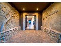 Elegant entryway with stonework, ornate doors, and tree carvings at 26607 N Avenida Del Ray --, Rio Verde, AZ 85263