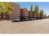 Apartment building with covered parking for residents at 12222 N Paradise Village S Pkwy # 339, Phoenix, AZ 85032