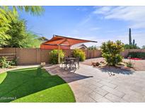 Backyard with patio, artificial turf, and a shade structure at 4601 E Peak View Rd, Cave Creek, AZ 85331