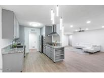 Modern kitchen with gray cabinets and granite countertops at 6767 N 7Th St # 240, Phoenix, AZ 85014