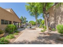 Inviting courtyard with fountain and lush landscaping at 5995 N 78Th St # 1108, Scottsdale, AZ 85250