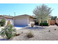 Charming single-story home with a two-car garage and well-manicured front yard at 3771 E Hazeltine Way, Chandler, AZ 85249