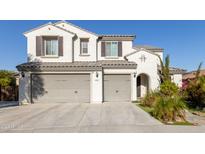 Two-story home with three car garage and neutral exterior at 26137 N 52Nd Ave, Phoenix, AZ 85083