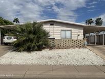 Ranch style home with carport and landscaped yard at 2661 N Higley Rd, Mesa, AZ 85215
