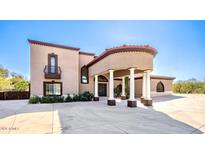 Stunning two-story home with a porte-cochère and manicured landscaping at 8170 E Golden Spur Ln, Carefree, AZ 85377