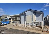 Mobile home with carport and fenced yard at 8700 E University Dr # 1322, Mesa, AZ 85207