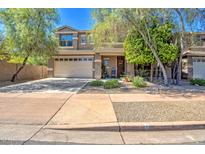Two-story house with attached garage and landscaping at 35202 N 30Th Dr, Phoenix, AZ 85086