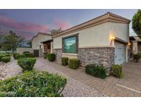 Elegant home exterior with stone accents and landscaping at 6202 E Mckellips Rd # 65, Mesa, AZ 85215