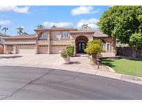 Two story home with three car garage and lush landscaping at 580 N Benson Ln, Chandler, AZ 85224