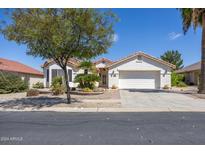 Single story home with two car garage and desert landscaping at 126 S Lucia Ln, Casa Grande, AZ 85194