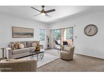 Bright living room with access to a patio at 16308 E Arrow Dr # 111, Fountain Hills, AZ 85268