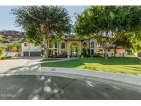 Stunning two-story home with a large front yard and mature trees at 14828 N 15Th Ave, Phoenix, AZ 85023