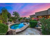 Stunning spa and pool area with a waterfall feature at 37295 N Boulder View Dr, Scottsdale, AZ 85262
